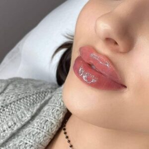 Close up of woman's glossy lips.