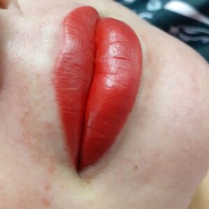 Close up of a person's red lips.