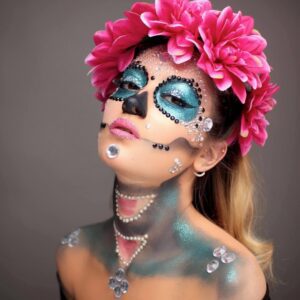 Woman with sugar skull makeup and flowers.