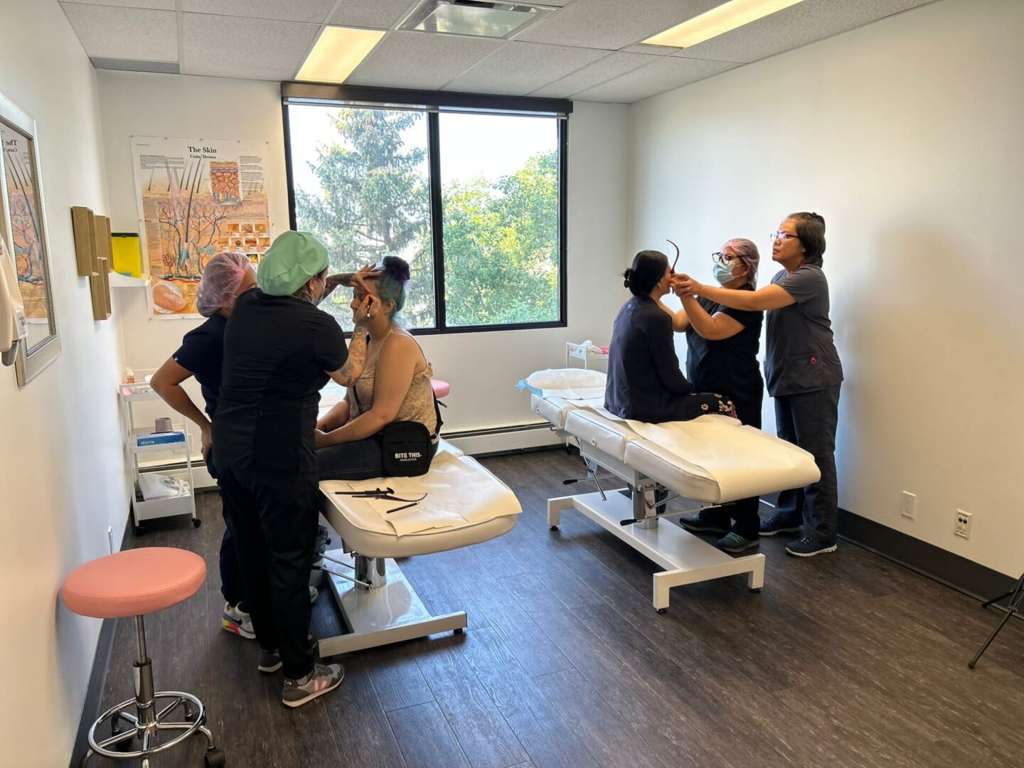 Three people in a medical clinic.